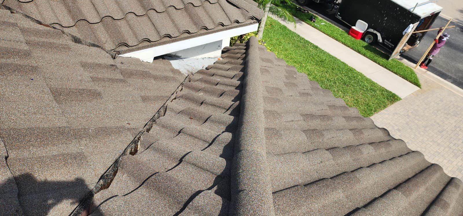 Damaged tile roof requiring professional repair services